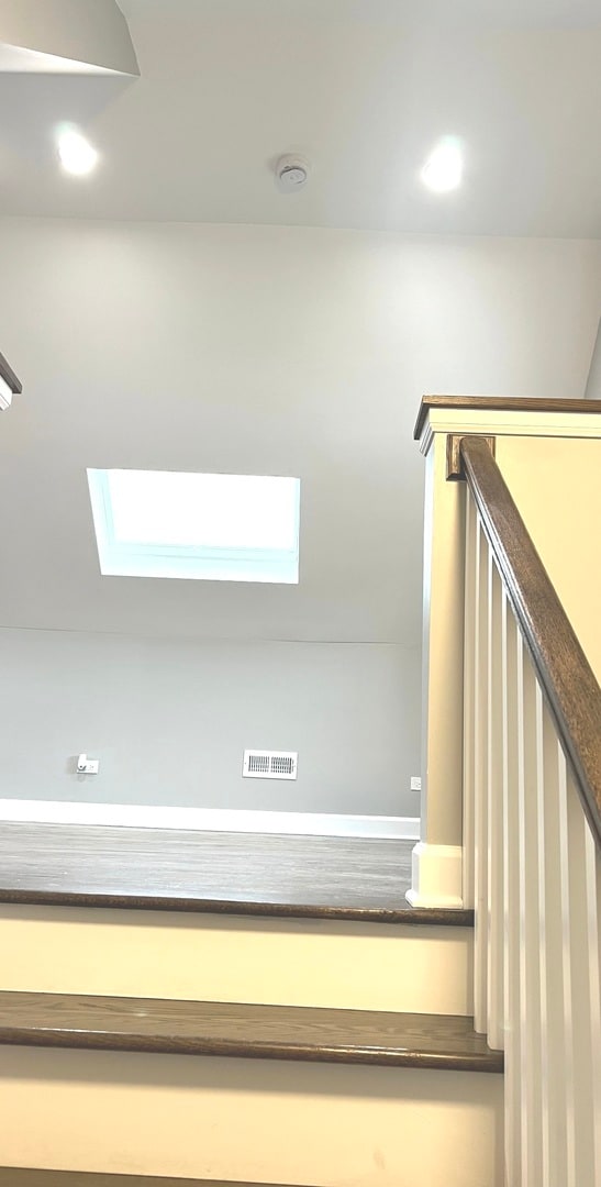 stairway with a skylight