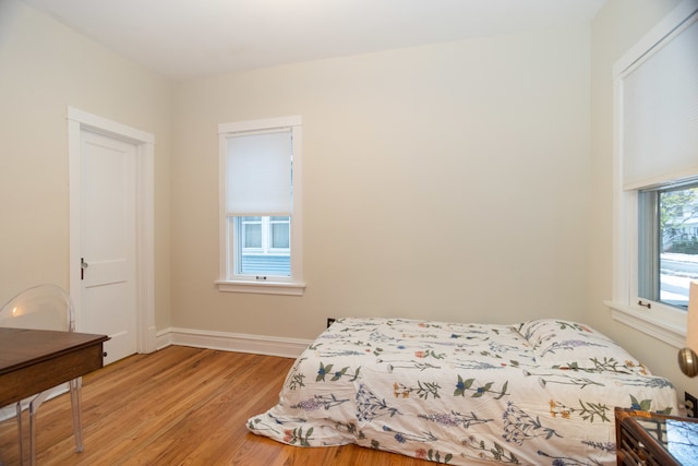 bedroom featuring light wood-type flooring