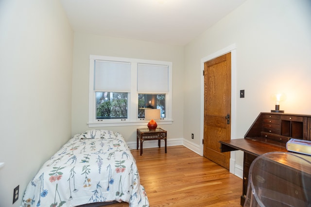 bedroom with light wood-type flooring