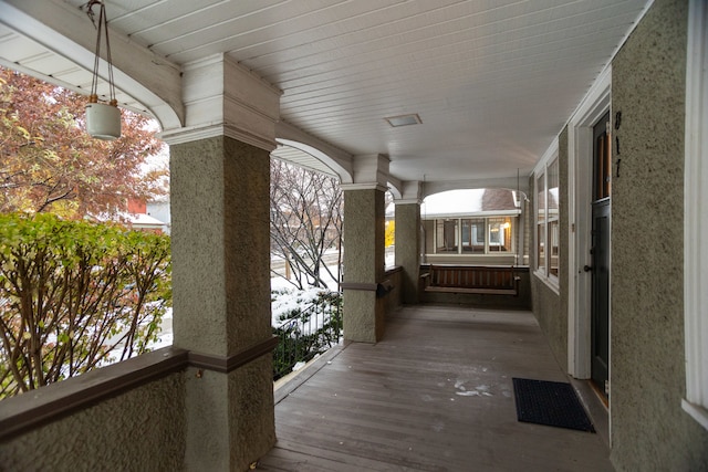 living room featuring light hardwood / wood-style flooring, a healthy amount of sunlight, and a brick fireplace