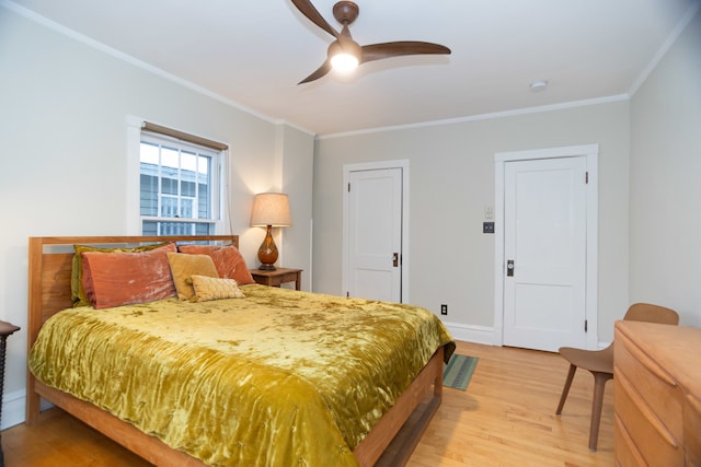 bedroom with ceiling fan, light hardwood / wood-style floors, and crown molding