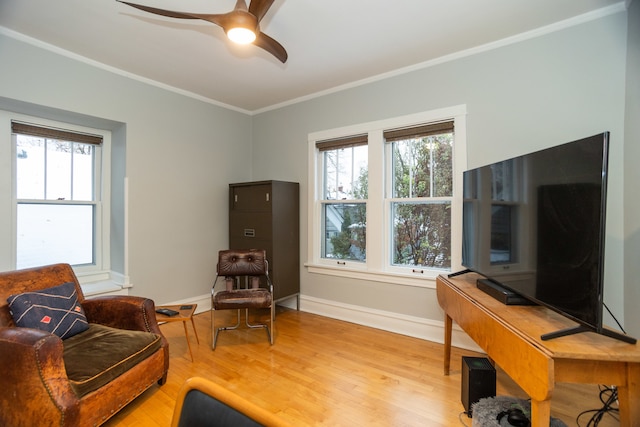 living room with ceiling fan, light hardwood / wood-style flooring, and ornamental molding