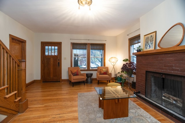 living room with a fireplace and hardwood / wood-style floors