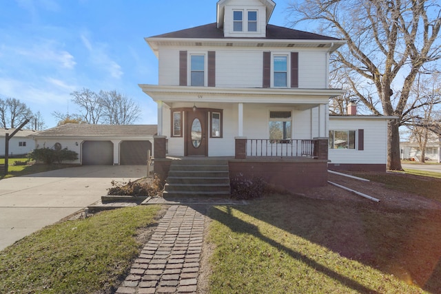 view of front of property featuring covered porch, a garage, an outbuilding, and a front yard