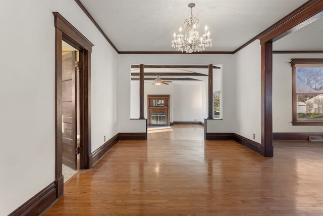 interior space with crown molding, dark hardwood / wood-style flooring, and a chandelier