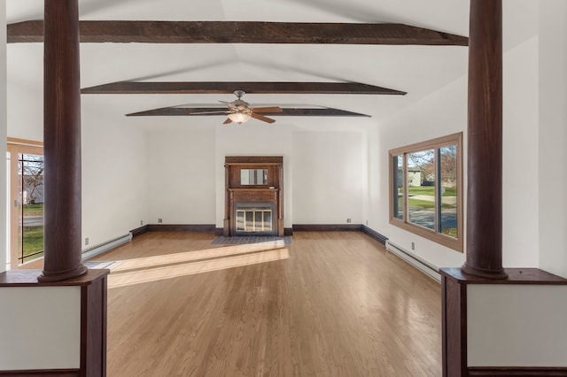 unfurnished living room featuring light wood-type flooring, ornate columns, ceiling fan, a baseboard heating unit, and vaulted ceiling with beams