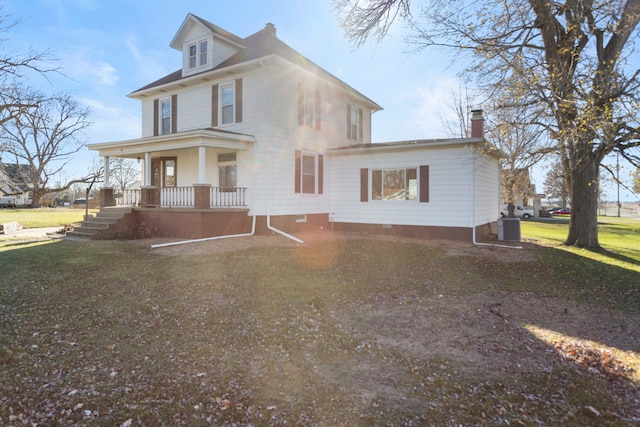 view of front of house with a porch, a front lawn, and central air condition unit