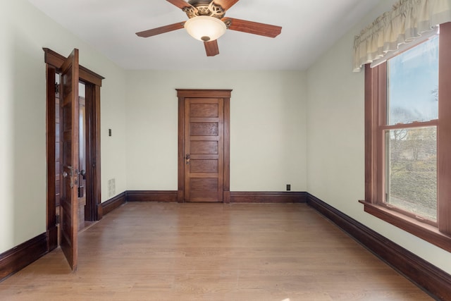 unfurnished room featuring ceiling fan and light hardwood / wood-style flooring