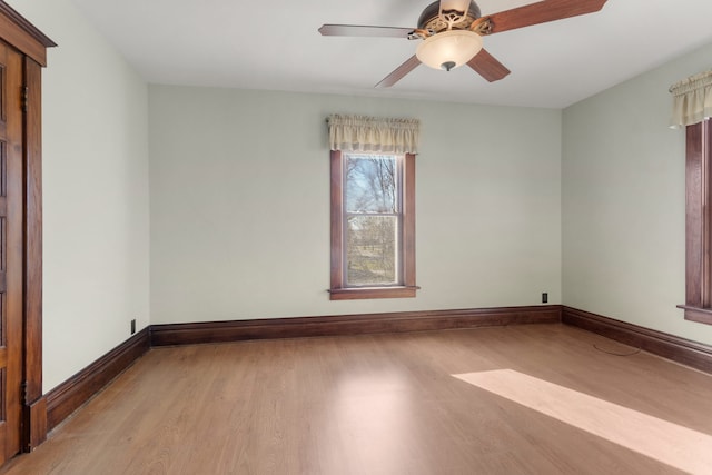 empty room with light hardwood / wood-style floors and ceiling fan