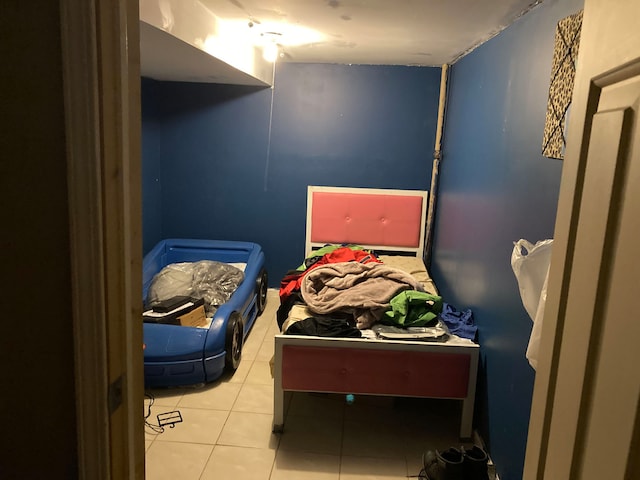 bedroom featuring light tile patterned floors