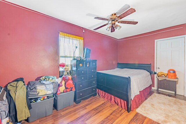 bedroom featuring ceiling fan and hardwood / wood-style floors