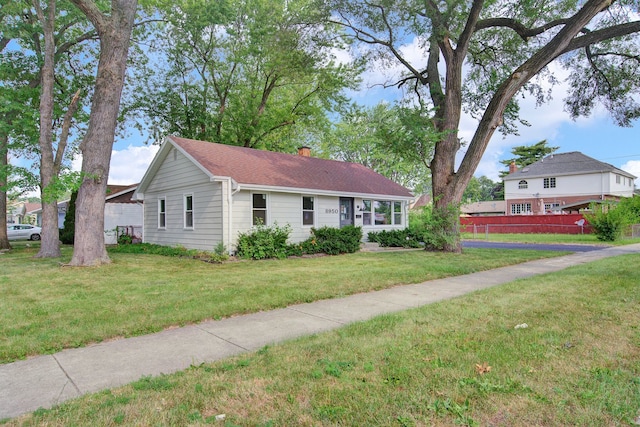 ranch-style home with a front yard