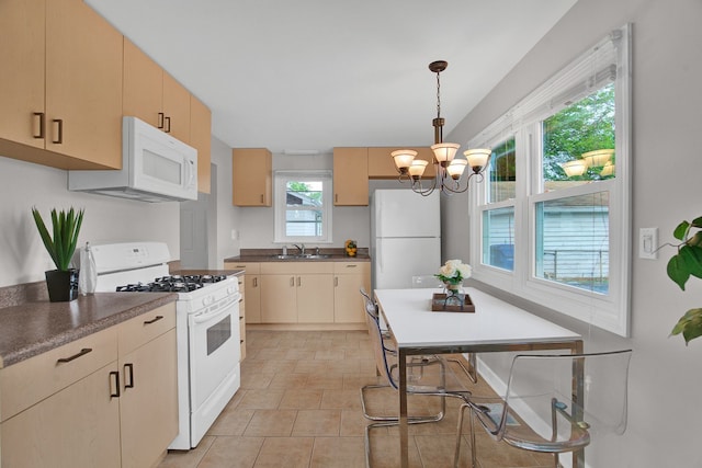 kitchen with light brown cabinets, white appliances, sink, decorative light fixtures, and a chandelier