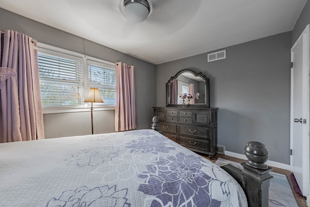 bedroom featuring hardwood / wood-style floors and ceiling fan