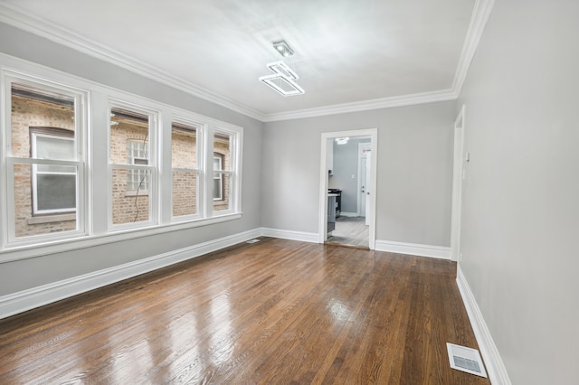 unfurnished room with dark hardwood / wood-style floors and ornamental molding