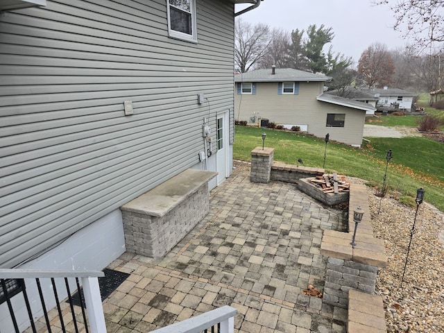 view of patio with an outdoor fire pit