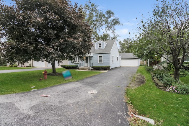 view of front of house with a front lawn and a garage