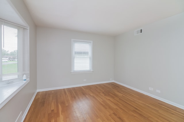 unfurnished room featuring wood-type flooring