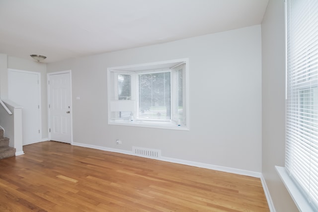 spare room with light wood-type flooring