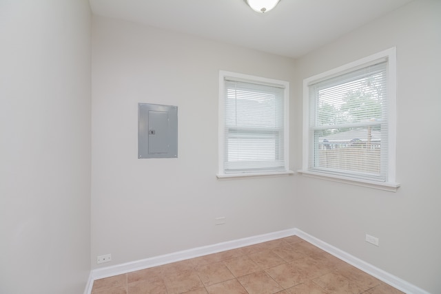 tiled spare room with electric panel