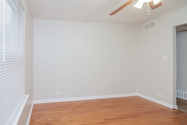 empty room featuring light hardwood / wood-style floors and ceiling fan