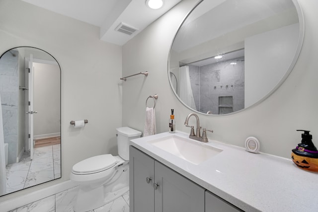 bathroom with a shower with curtain, vanity, and toilet