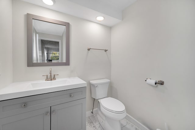 bathroom featuring vanity and toilet