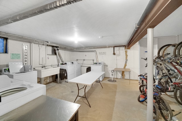 basement with washing machine and dryer and sink