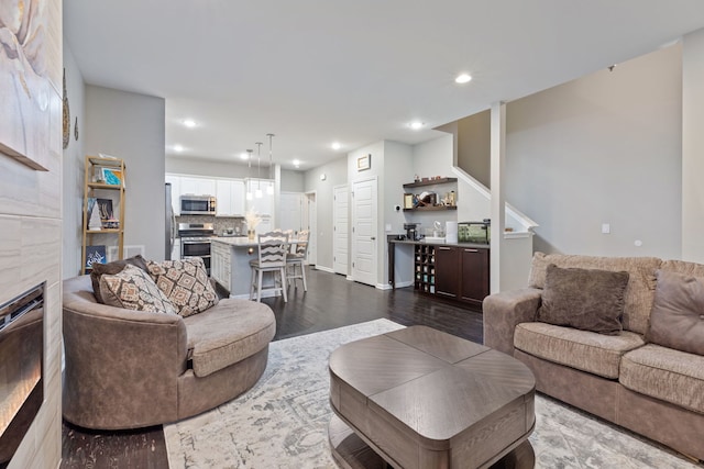 living room with dark wood-type flooring