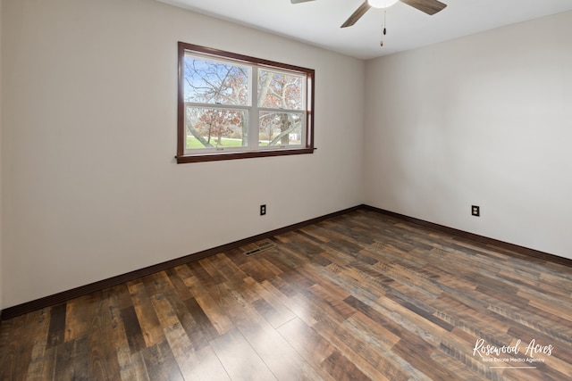 unfurnished room with dark hardwood / wood-style floors and ceiling fan