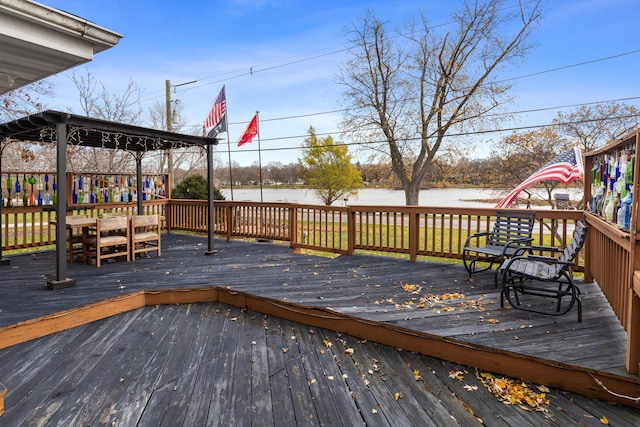 wooden terrace with a water view