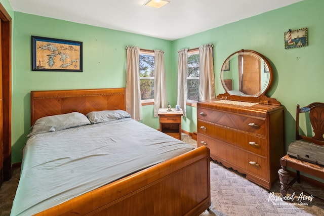 bedroom with light colored carpet