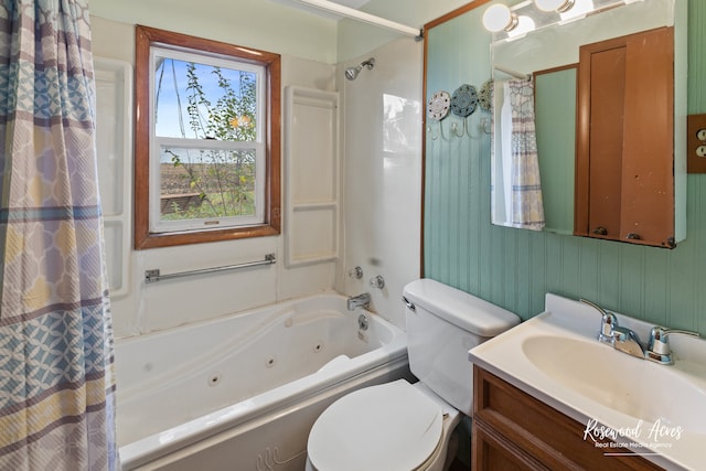 full bathroom with shower / tub combo with curtain, vanity, and toilet