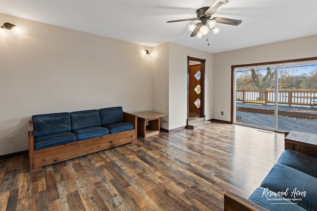 living room featuring ceiling fan and wood-type flooring