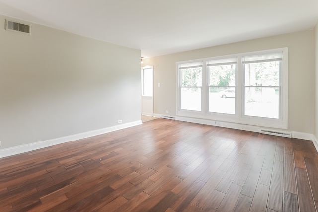 unfurnished room featuring dark wood-type flooring