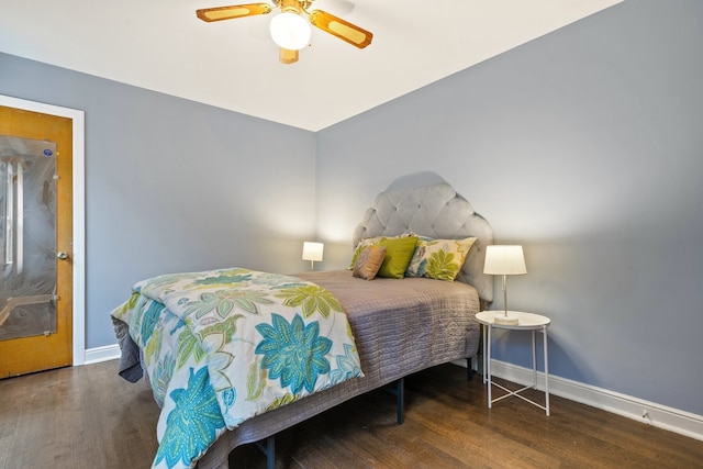 bedroom with ceiling fan and dark hardwood / wood-style flooring