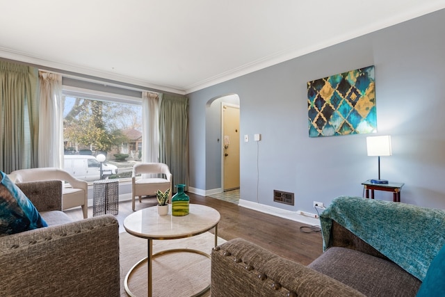 living room featuring crown molding and hardwood / wood-style floors