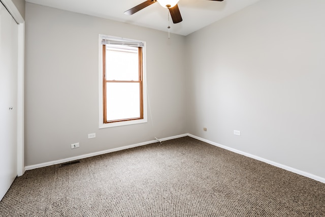 unfurnished room featuring carpet floors and ceiling fan