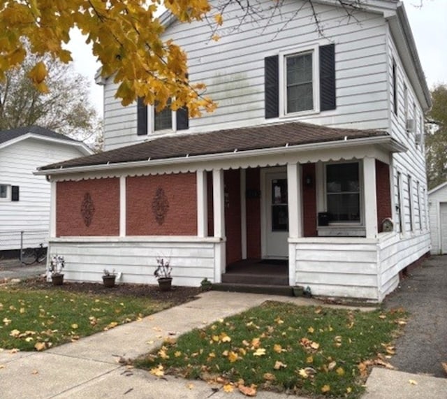 traditional style home featuring a porch