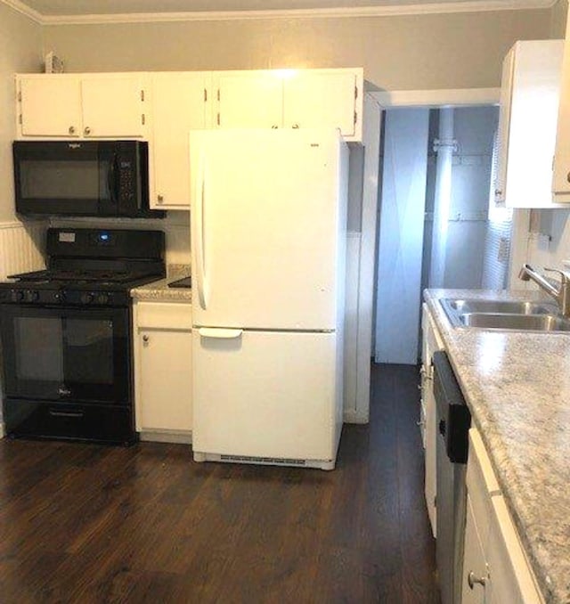 kitchen with dark wood-style floors, a sink, black appliances, light countertops, and white cabinetry