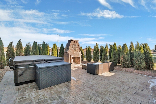 view of patio with an outdoor living space with a fireplace