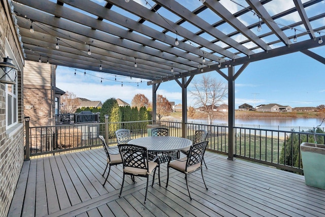 deck featuring a pergola and a water view