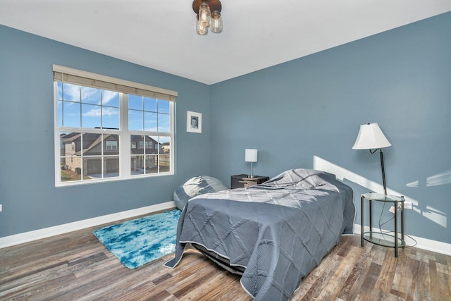 bedroom featuring wood-type flooring