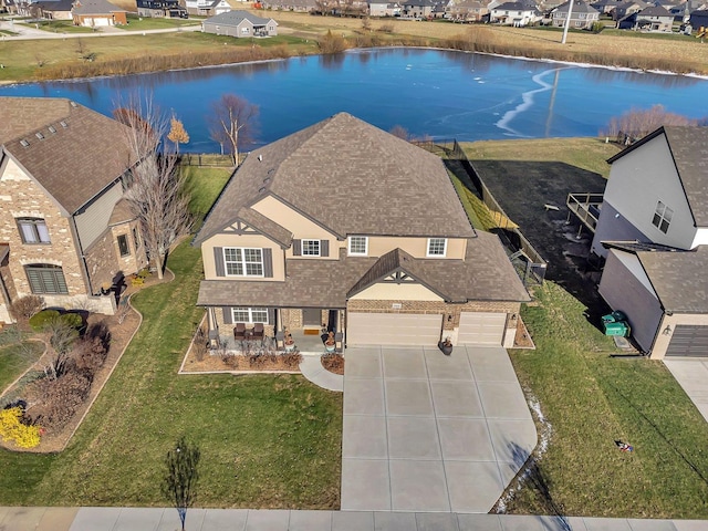 bird's eye view with a water view