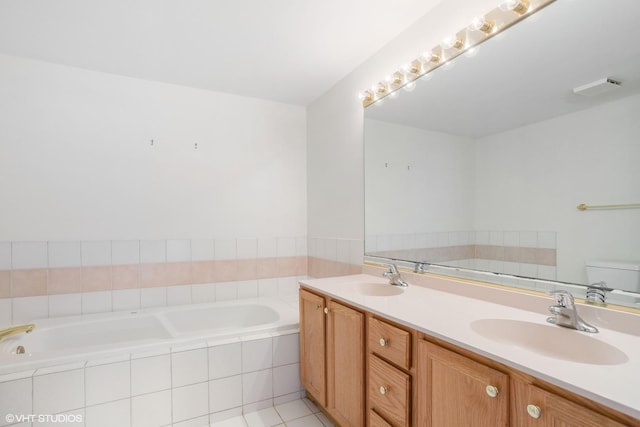 bathroom with tile patterned flooring, vanity, and toilet