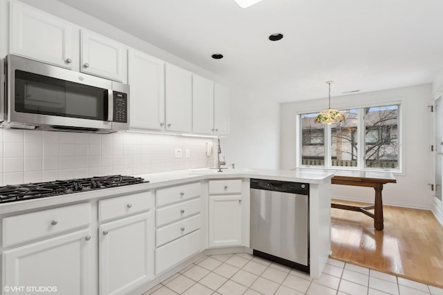 kitchen with white cabinets and stainless steel appliances