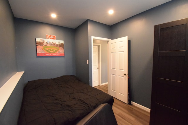 bedroom with light hardwood / wood-style floors