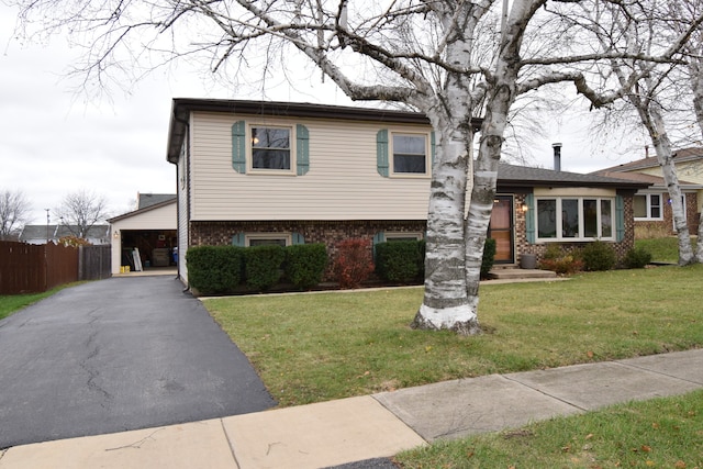 tri-level home featuring a front yard