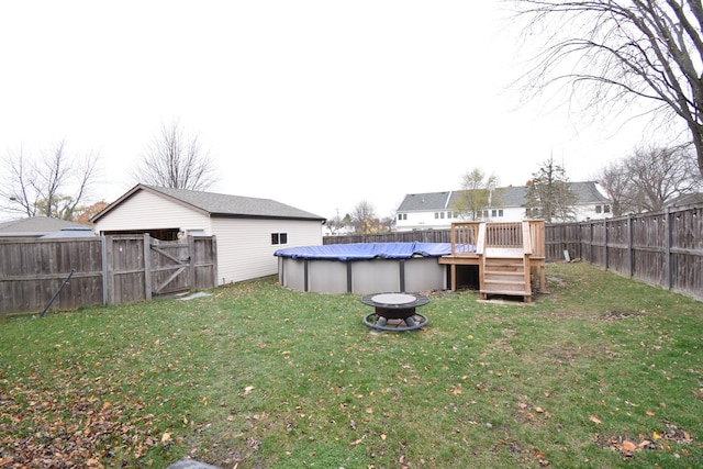 view of yard with a pool side deck