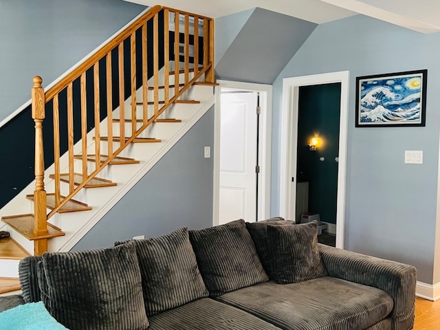 living room with hardwood / wood-style floors and vaulted ceiling